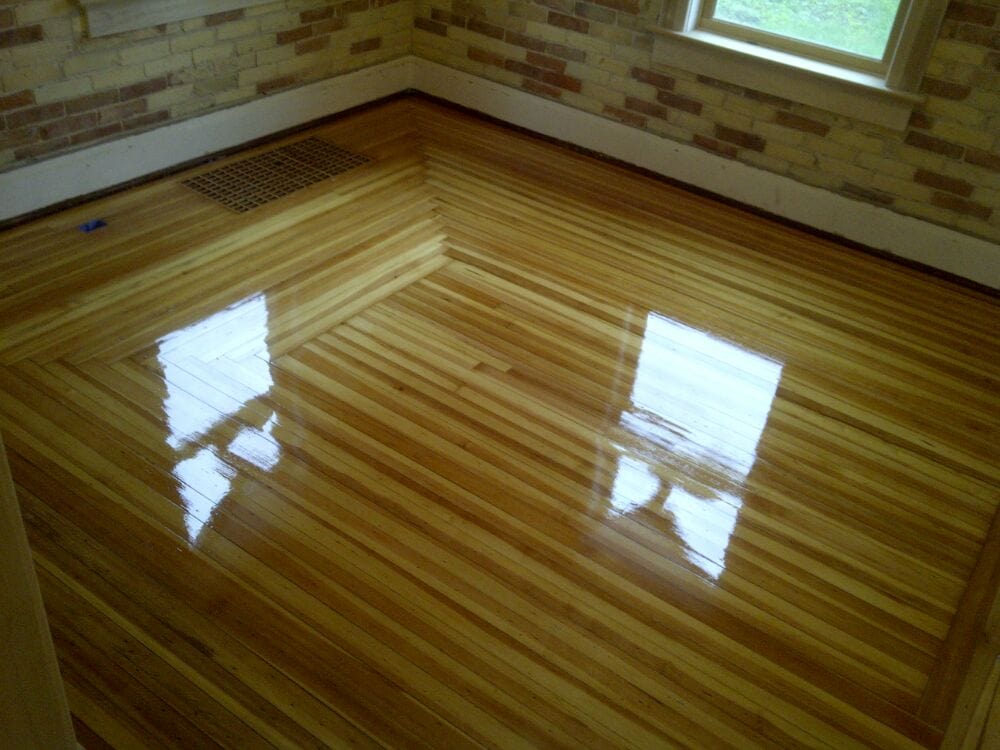 Bild Wood Floor - Refinished Antique Heart Pine with Herringbone Woven Corners - Grand Haven, MI
